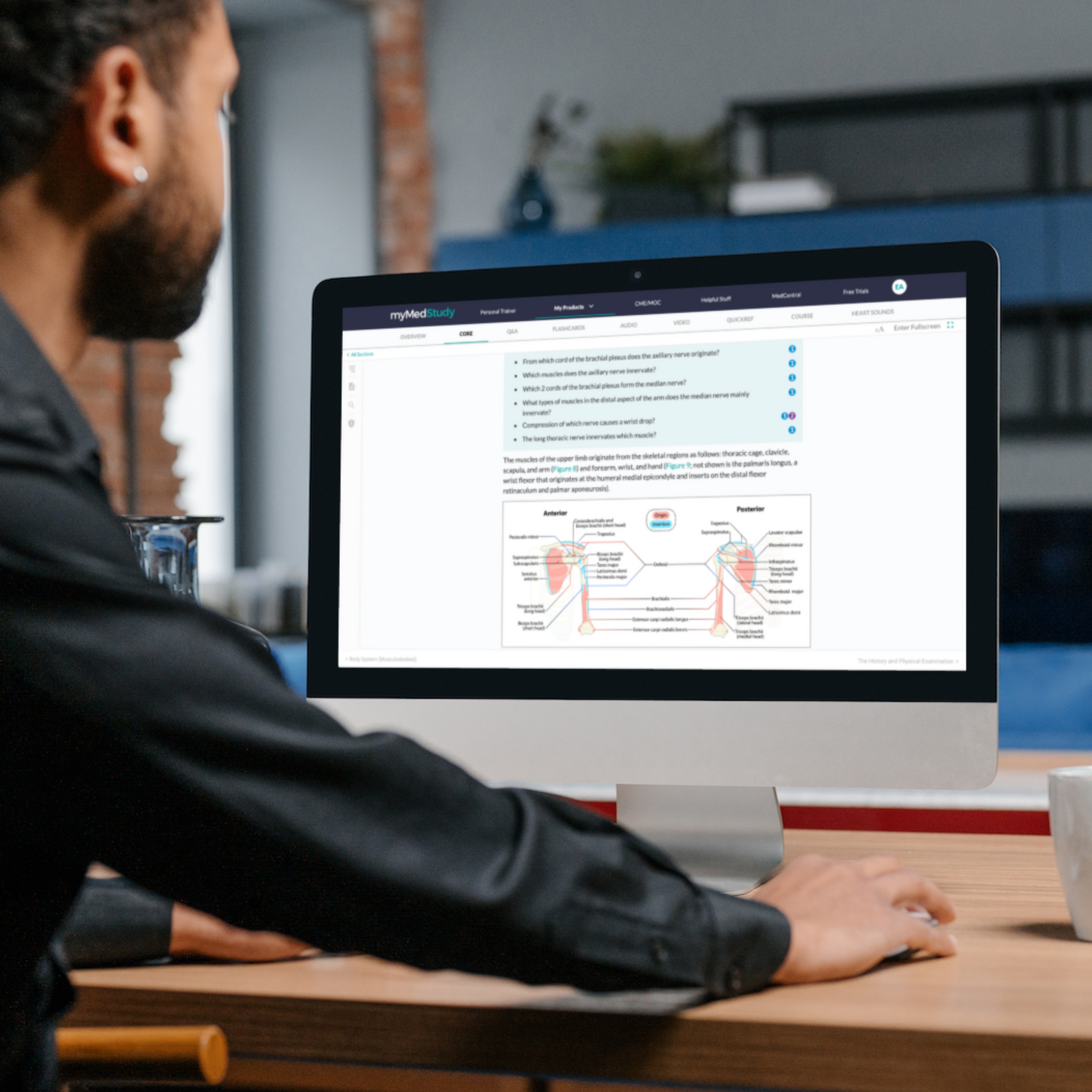 medical student african american man at computer with medical student core on screen