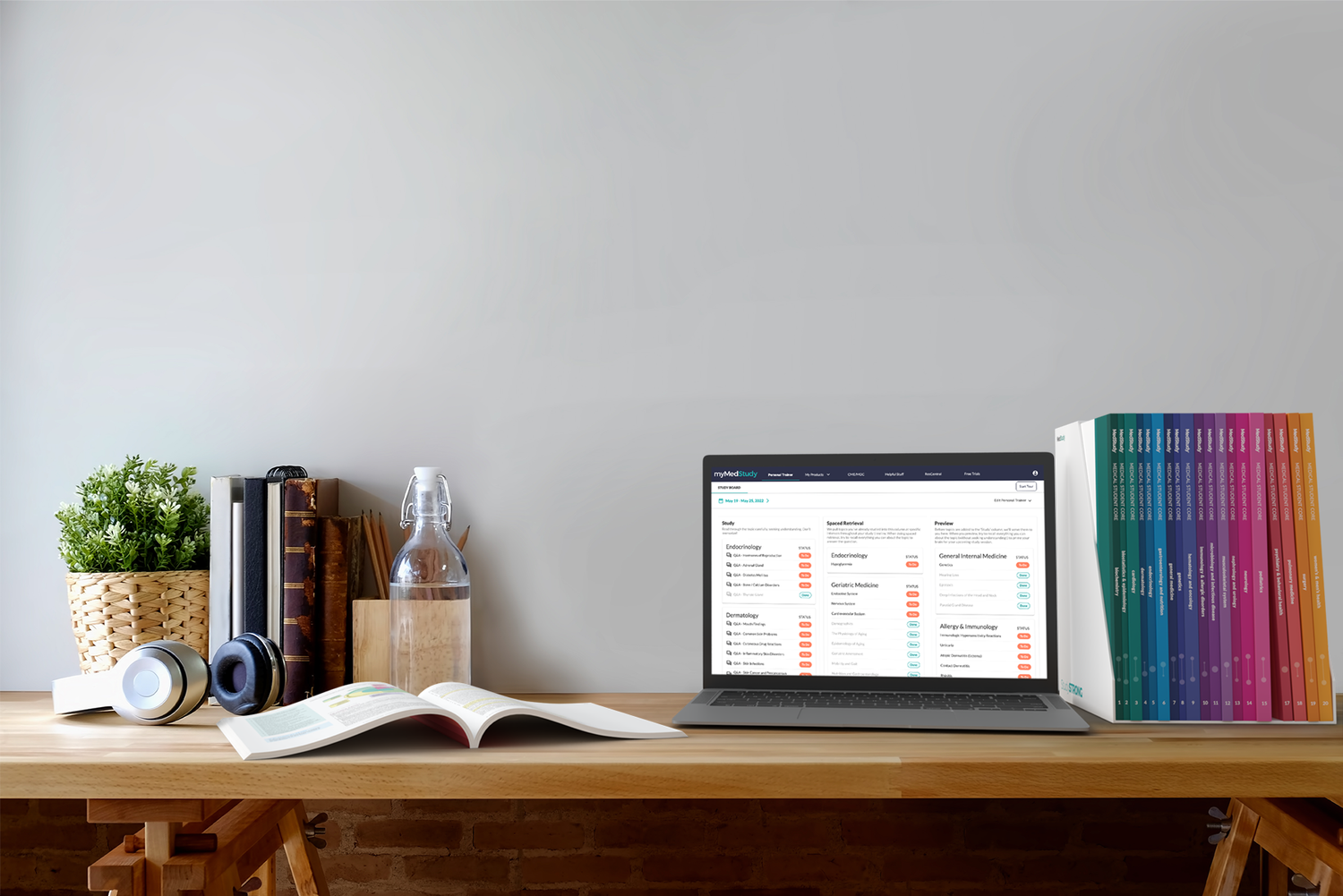 medical student system set of 20 books and laptop showing personal trainer on someone's desk