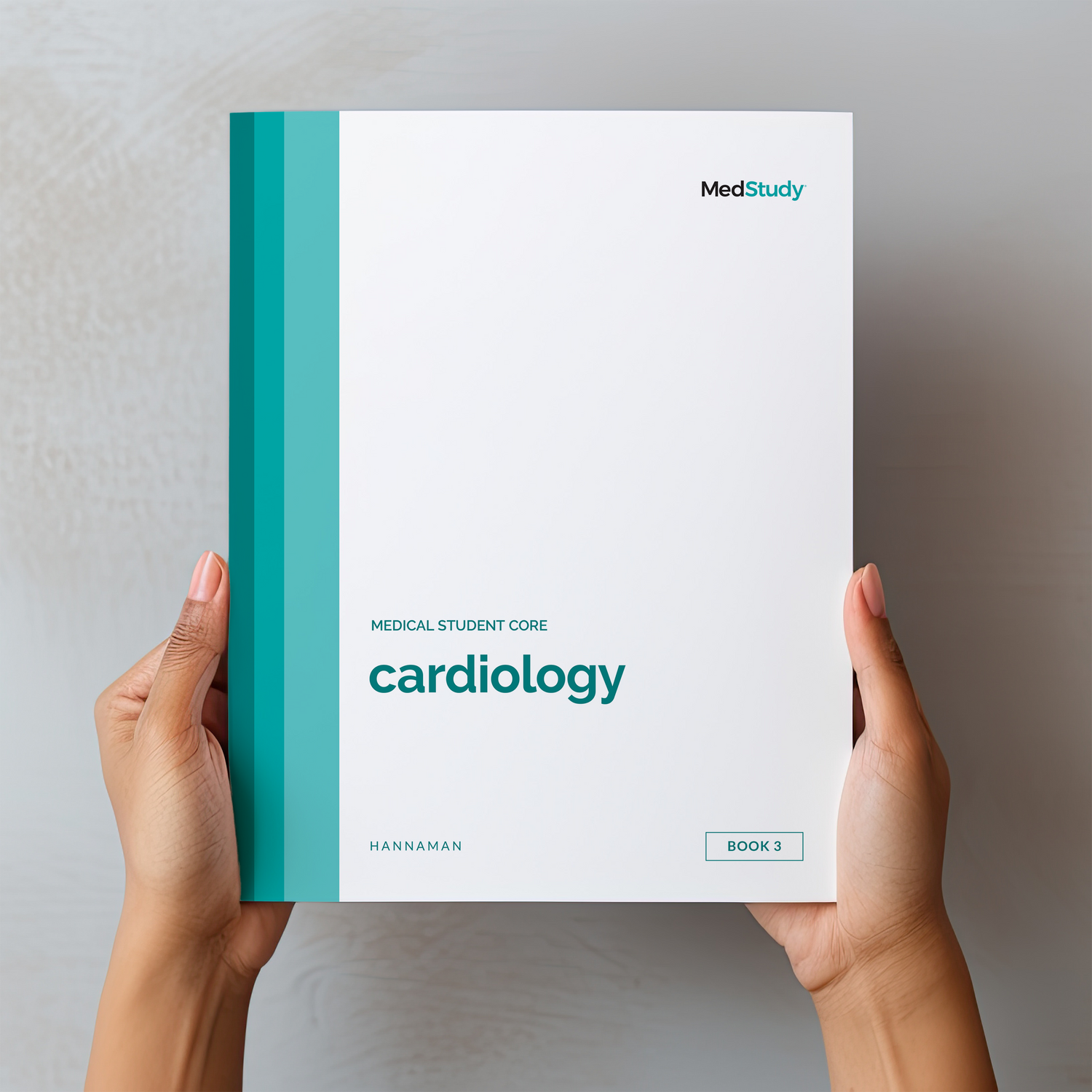 Hands holding the medical student core Cardiology book
